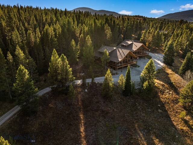 TBD Buttermilk Court, West Yellowstone, MT 59758 - view from above of property with a forest and a mountainous background
