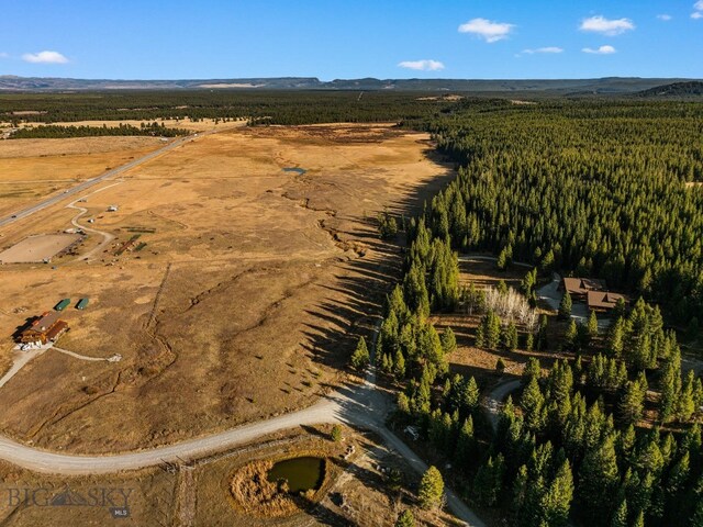 TBD Buttermilk Court, West Yellowstone, MT 59758 - aerial view of property's location with a mountainous background and rural landscape