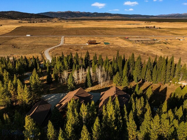 TBD Buttermilk Court, West Yellowstone, MT 59758 - aerial overview of property's location featuring rural landscape and a mountain backdrop