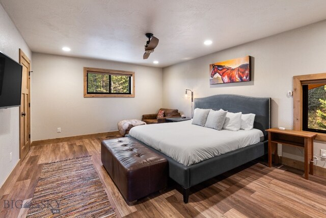 TBD Buttermilk Court, West Yellowstone, MT 59758 - bedroom featuring wood finished floors, multiple windows, baseboards, recessed lighting, and a ceiling fan