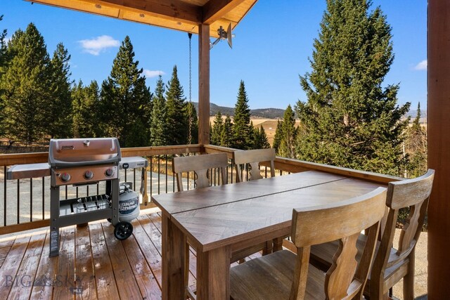 TBD Buttermilk Court, West Yellowstone, MT 59758 - wooden deck with outdoor dining area, grilling area, and a mountain view