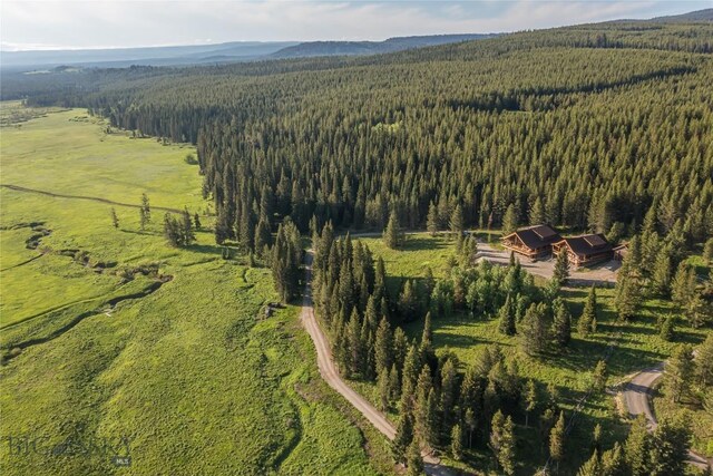TBD Buttermilk Court, West Yellowstone, MT 59758 - aerial view of property and surrounding area featuring a heavily wooded area