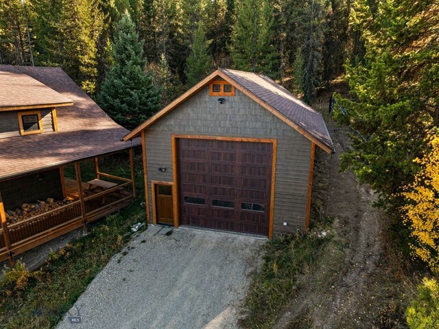 TBD Buttermilk Court, West Yellowstone, MT 59758 - detached garage with driveway and a wooded view