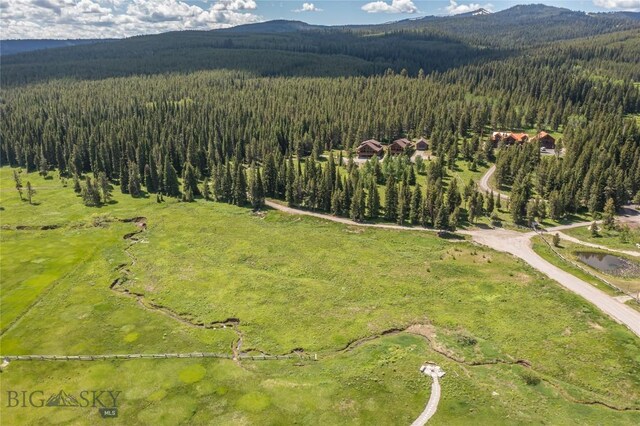 TBD Buttermilk Court, West Yellowstone, MT 59758 - aerial view of property's location featuring a forest and a mountainous background