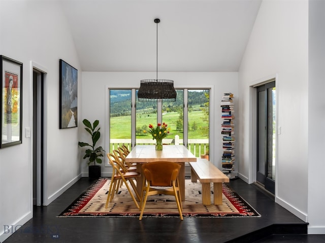 370 Star Ridge Rd, Bozeman, MT 59715 - dining space with dark wood-style flooring, high vaulted ceiling, and baseboards