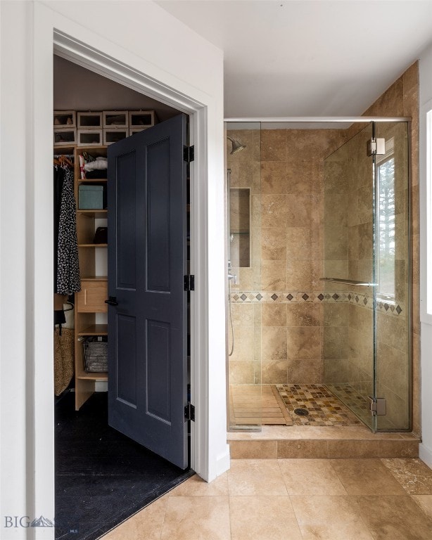 370 Star Ridge Rd, Bozeman, MT 59715 - bathroom with a shower stall, a spacious closet, and tile patterned floors