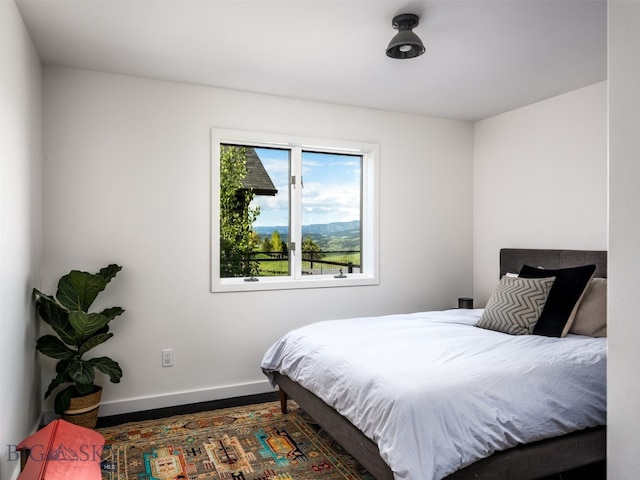 370 Star Ridge Rd, Bozeman, MT 59715 - bedroom featuring baseboards and wood finished floors