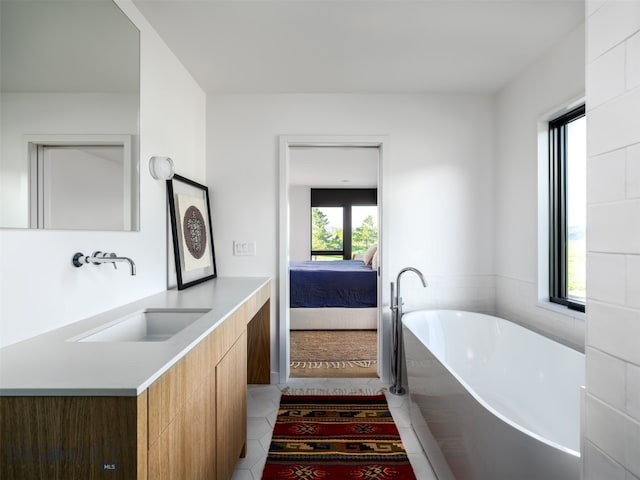 370 Star Ridge Rd, Bozeman, MT 59715 - ensuite bathroom featuring a freestanding bath, vanity, and tile patterned floors