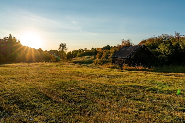 370 Star Ridge Rd, Bozeman, MT 59715 - view of green lawn with a rural view and an outbuilding