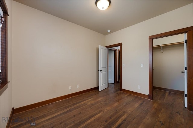 4364 Brookside Ln, Bozeman, MT 59718 - unfurnished bedroom featuring dark wood-style floors, baseboards, and a closet