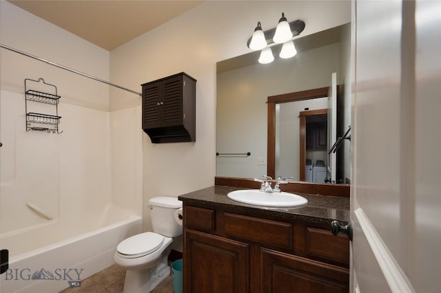 4364 Brookside Ln, Bozeman, MT 59718 - full bathroom with washer and clothes dryer, vanity, toilet, bathtub / shower combination, and tile patterned floors