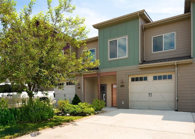 4364 Brookside Ln, Bozeman, MT 59718 - view of property featuring board and batten siding, a garage, and driveway
