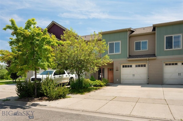 4364 Brookside Ln, Bozeman, MT 59718 - view of property with board and batten siding, driveway, and a garage