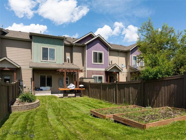 4364 Brookside Ln, Bozeman, MT 59718 - back of property with a garden, a patio, and board and batten siding