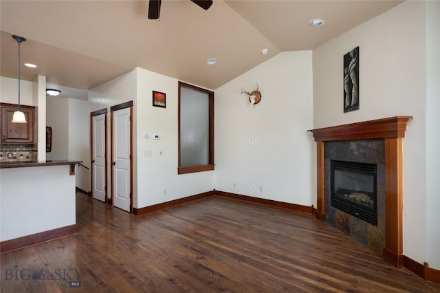 4364 Brookside Ln, Bozeman, MT 59718 - unfurnished living room with dark wood-style floors, vaulted ceiling, ceiling fan, a fireplace, and recessed lighting
