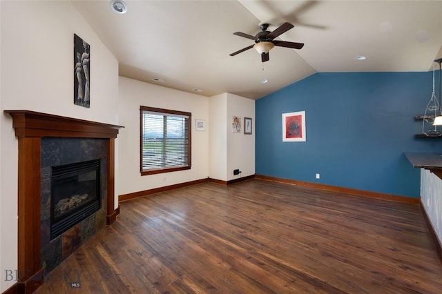 4364 Brookside Ln, Bozeman, MT 59718 - unfurnished living room with a ceiling fan, wood finished floors, a fireplace, vaulted ceiling, and baseboards