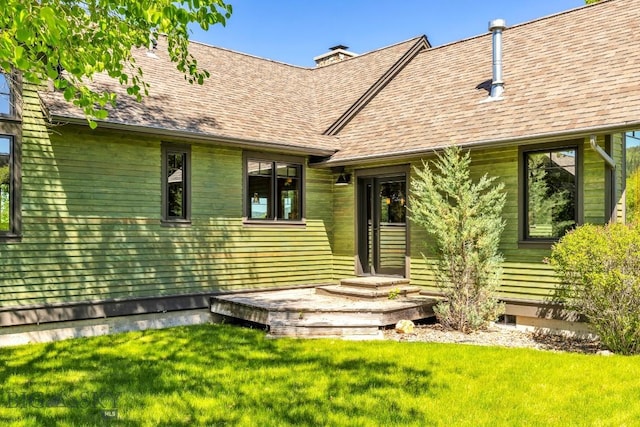 2594 Star Ridge Rd, Bozeman, MT 59715 - property entrance with a yard, a chimney, and roof with shingles