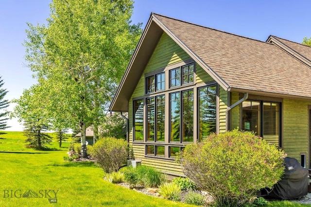 2594 Star Ridge Rd, Bozeman, MT 59715 - view of property exterior with a yard and roof with shingles