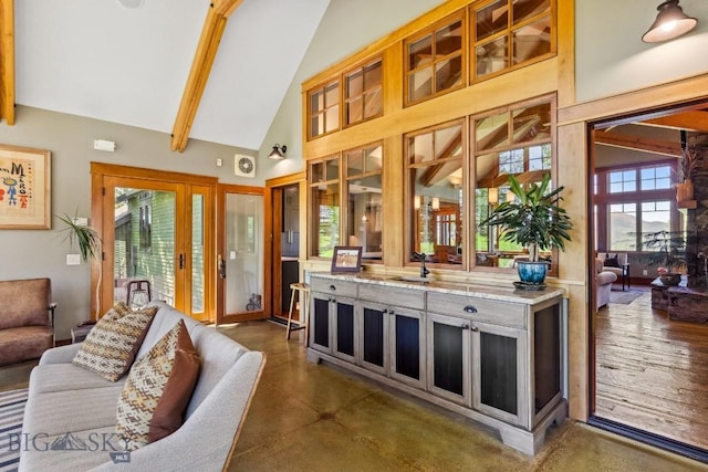 2594 Star Ridge Rd, Bozeman, MT 59715 - living room featuring high vaulted ceiling, beam ceiling, and concrete floors