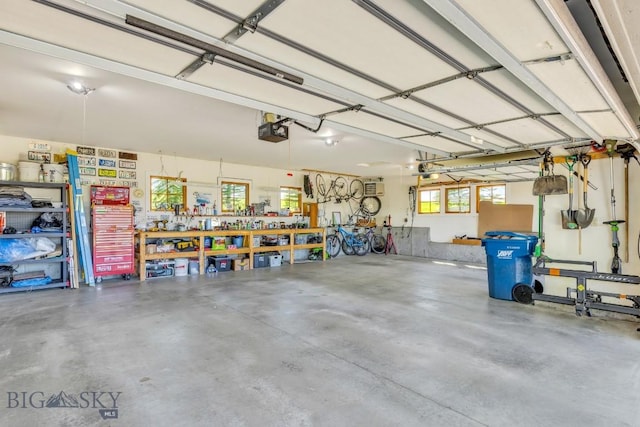2594 Star Ridge Rd, Bozeman, MT 59715 - garage with a garage door opener and a workshop area