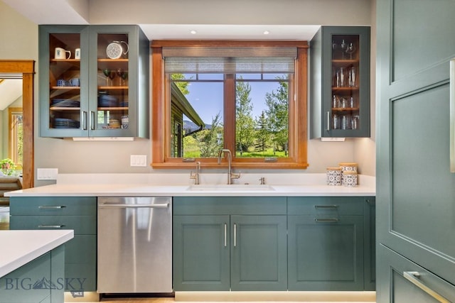 2594 Star Ridge Rd, Bozeman, MT 59715 - kitchen with stainless steel dishwasher, green cabinets, and light countertops
