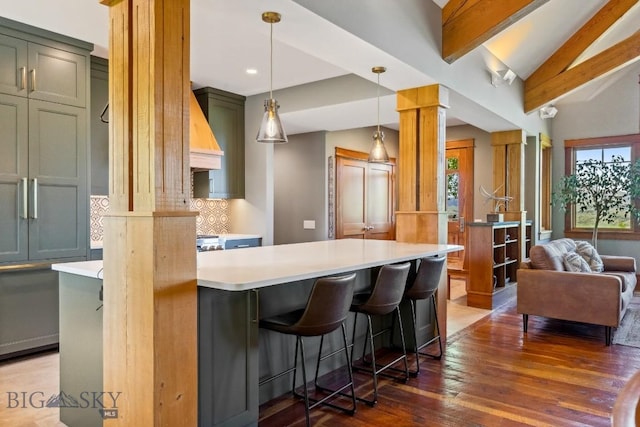 2594 Star Ridge Rd, Bozeman, MT 59715 - kitchen featuring ornate columns, plenty of natural light, dark wood-type flooring, decorative backsplash, and recessed lighting