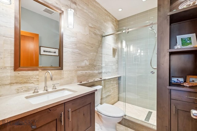 2594 Star Ridge Rd, Bozeman, MT 59715 - full bath featuring a shower stall, vanity, tile walls, and tasteful backsplash