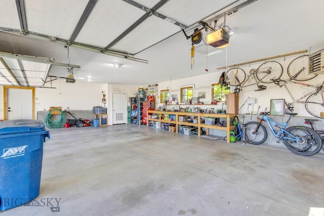 2594 Star Ridge Rd, Bozeman, MT 59715 - garage with a garage door opener and a workshop area