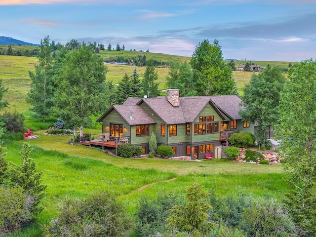 2594 Star Ridge Rd, Bozeman, MT 59715 - rear view of property with a chimney and a deck