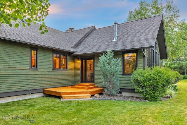2594 Star Ridge Rd, Bozeman, MT 59715 - view of front of house featuring a front yard and a shingled roof