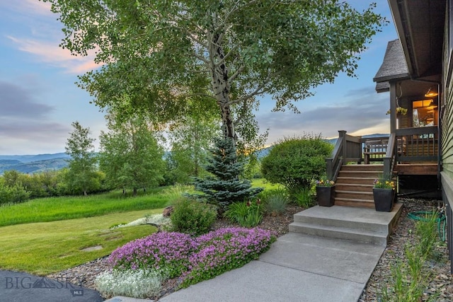 2594 Star Ridge Rd, Bozeman, MT 59715 - yard at dusk featuring stairs, a yard, and a wooden deck