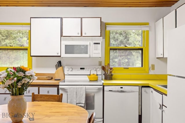140 Luhn, Gallatin Gateway, MT 59730 - kitchen with white appliances, white cabinets, and light countertops