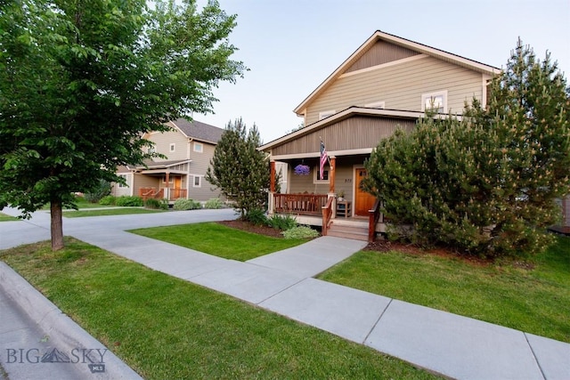 975 Jessie Way, Bozeman, MT 59715 - view of front of home featuring a porch and a front lawn