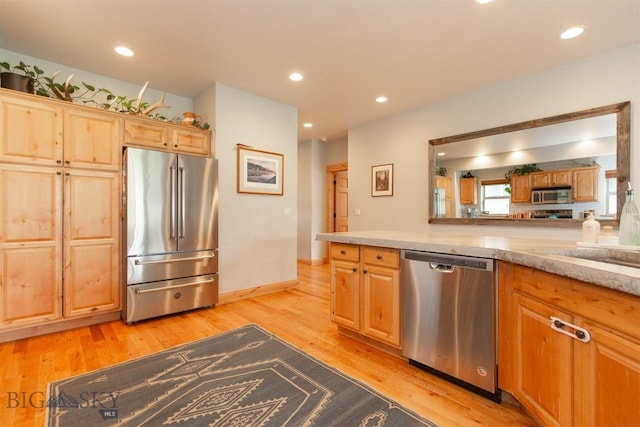 975 Jessie Way, Bozeman, MT 59715 - kitchen featuring appliances with stainless steel finishes, light wood-type flooring, light brown cabinets, and recessed lighting
