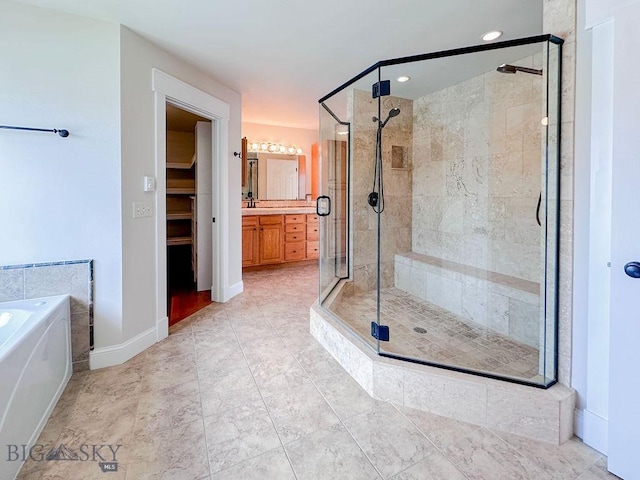 2475 Rose St, Bozeman, MT 59718 - bathroom featuring a shower stall, a bath, vanity, and a walk in closet