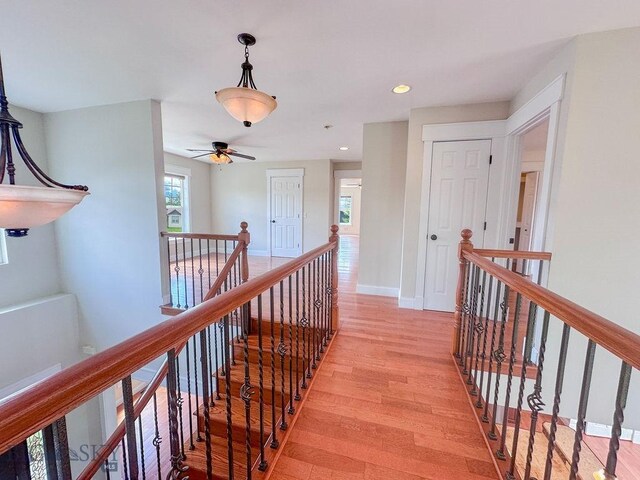 2475 Rose St, Bozeman, MT 59718 - hall with an upstairs landing, light wood-type flooring, recessed lighting, and baseboards