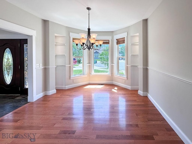 2475 Rose St, Bozeman, MT 59718 - foyer entrance featuring a chandelier, wood finished floors, and baseboards
