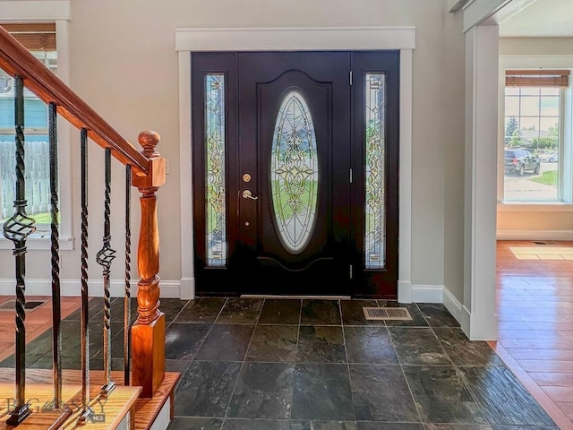 2475 Rose St, Bozeman, MT 59718 - foyer entrance featuring healthy amount of natural light, stairs, and stone tile floors