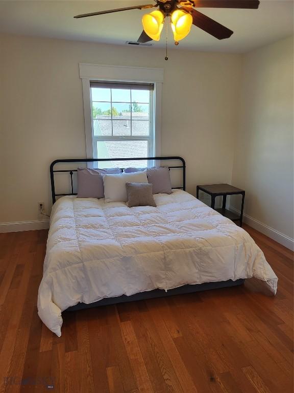 2475 Rose St, Bozeman, MT 59718 - bedroom featuring baseboards, wood finished floors, and ceiling fan