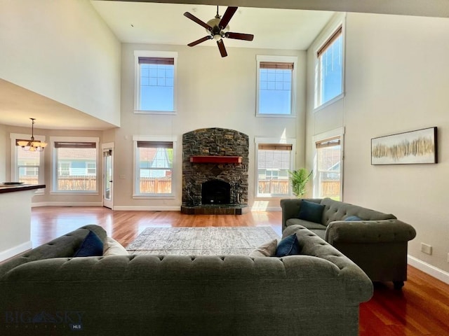 2475 Rose St, Bozeman, MT 59718 - living room with a towering ceiling, healthy amount of natural light, wood finished floors, and a ceiling fan