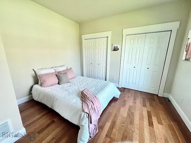 2475 Rose St, Bozeman, MT 59718 - bedroom featuring two closets and wood finished floors