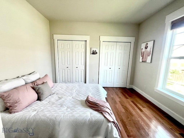 2475 Rose St, Bozeman, MT 59718 - bedroom featuring multiple closets and dark wood-style flooring