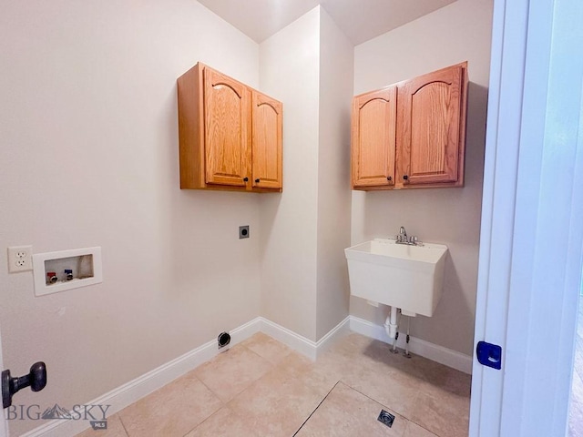 2475 Rose St, Bozeman, MT 59718 - laundry room with cabinet space, washer hookup, hookup for an electric dryer, and light tile patterned floors
