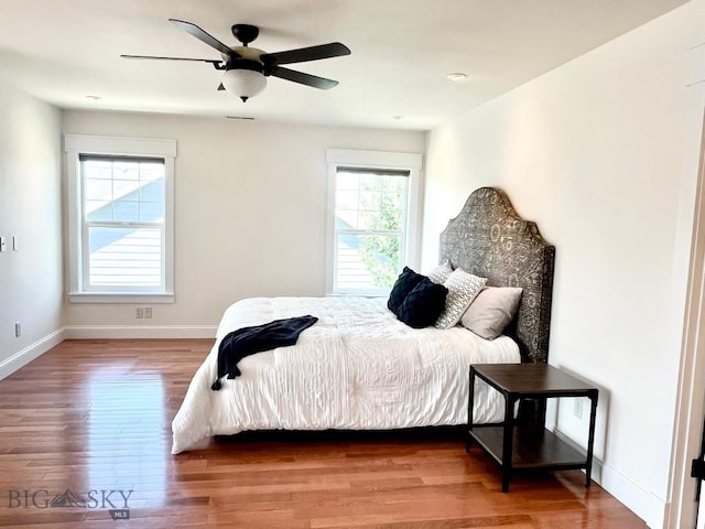2475 Rose St, Bozeman, MT 59718 - bedroom with wood finished floors and a ceiling fan
