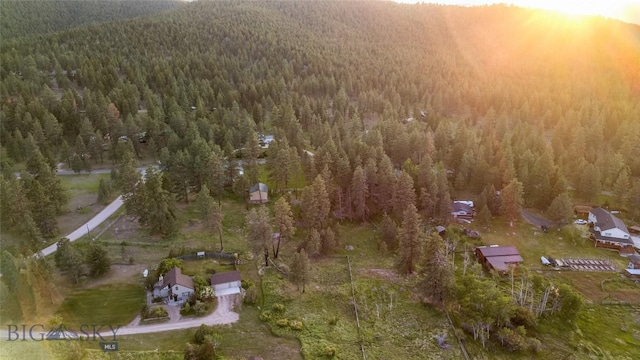 1561/1563 Colorado Gulch Dr, Helena, MT 59601 - aerial view of property and surrounding area with a heavily wooded area