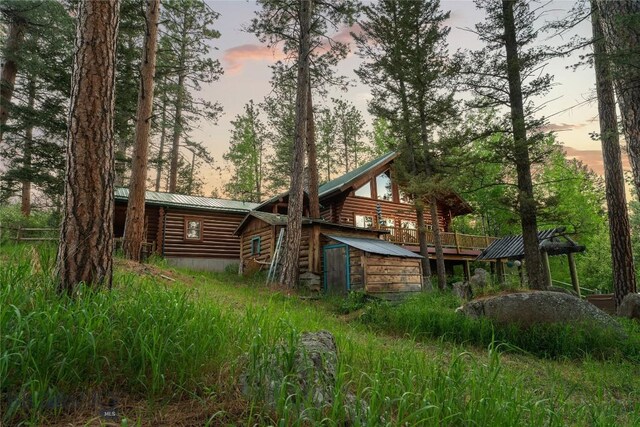1561/1563 Colorado Gulch Dr, Helena, MT 59601 - rear view of house featuring log siding and a metal roof