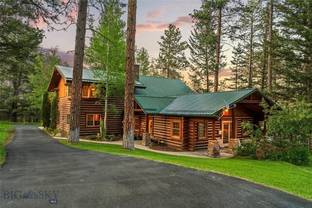 1561/1563 Colorado Gulch Dr, Helena, MT 59601 - cabin with a chimney, a metal roof, asphalt driveway, and log siding