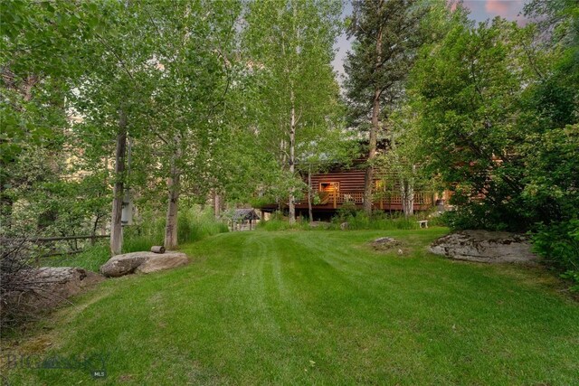 1561/1563 Colorado Gulch Dr, Helena, MT 59601 - view of green lawn featuring a wooden deck