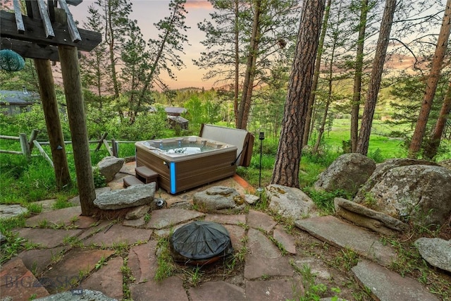 1561/1563 Colorado Gulch Dr, Helena, MT 59601 - patio terrace at dusk with a hot tub