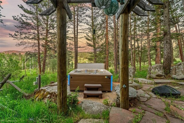 1561/1563 Colorado Gulch Dr, Helena, MT 59601 - view of patio with a hot tub